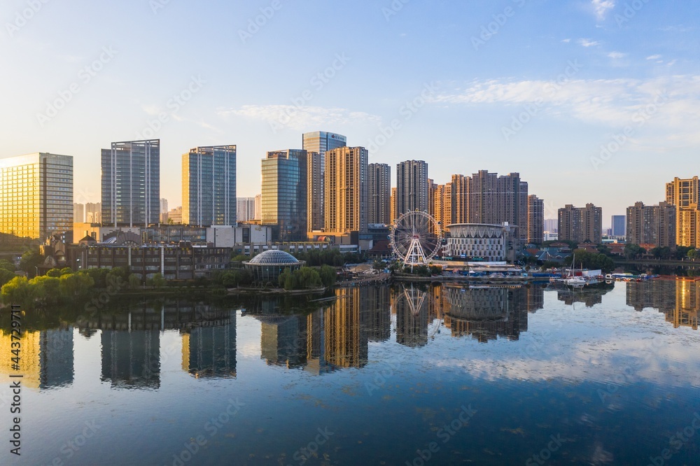 Wall mural skyline by baijia lake at sunrise in nanjing city in summer