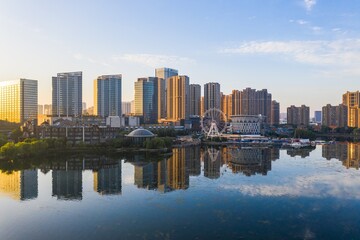 Fototapeta premium Skyline by Baijia lake at sunrise in Nanjing city in summer