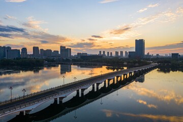 Fototapeta premium Skyline by Baijia lake at sunrise in Nanjing city in summer