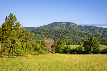 Scenic overlook of Shenandoah blue ridge mountains and hills from farmland in the morning