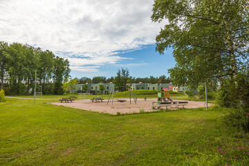 Fototapeta na wymiar Beautiful view of playground near modern swedish village. Sweden. 