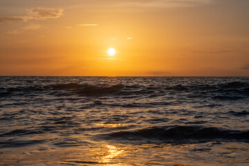Fototapeta na wymiar sunlight sunrise reflecting on the water