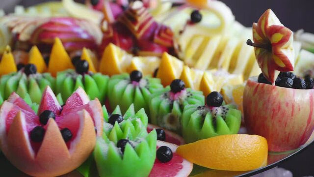 Beautifully decorated exotic fruit on a party by the beach