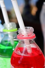 Close up of soft drink green and red on bottle
