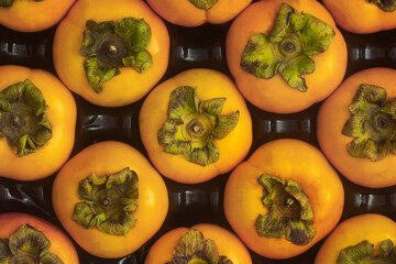 Persimmons fruits presentation, top view.