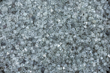 A scattering of various diamonds. Abstract background. Uncut gems, natural shape