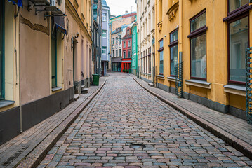 Plakat Narrow old street in Riga town on a winter day in Latvia