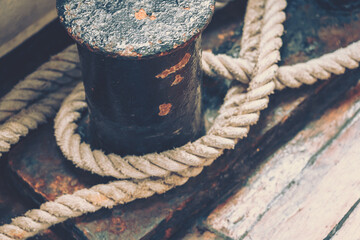 Fototapeta na wymiar Close-up of an old boat rope; vintage style