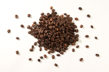 Roasted coffee beans isolated on white background.