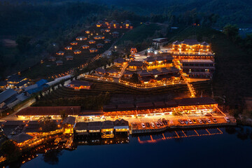 Fototapeta premium Aerial view of Rak thai village at night in Mae Hong Son province, Thailand.