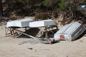 Upturned boats on the beach near Dennes Point, North Bruny, Tasmania, Australia..