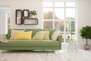 Stylish room in white color with sofa and autumn landscape in window. Scandinavian interior design. 3D illustration