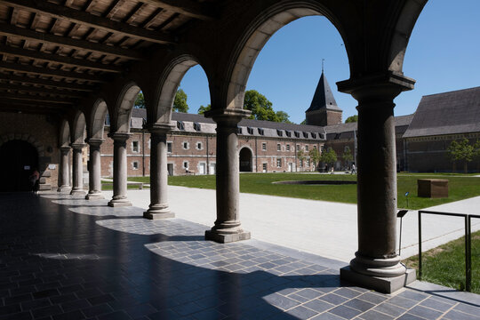 BILZEN, BELGIUM - MAY 30 2021: Alden Biesen castle seen from the covered courtyard with colonnade in Belgium, in the small village of Rijkhoven in the municipality of Bilzen in the province of Limburg