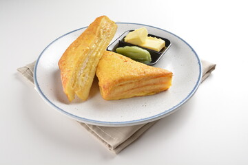 baked layer French cheese egg toast with kaya jam and butter with half boiled egg in bowl western mixed asian halal menu