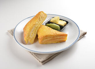 baked layer French cheese egg toast with kaya jam and butter with half boiled egg in bowl western mixed asian halal menu