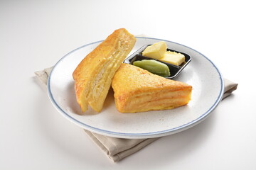 baked layer French cheese egg toast with kaya jam and butter with half boiled egg in bowl western...