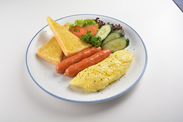 western big breakfast with butter toast, fried scramble egg, sausage, grill bacon, ham, omelette, bean and salad halal breakfast menu 