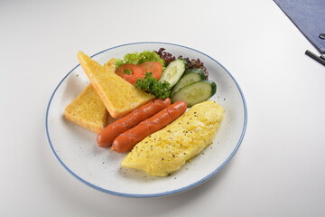 western big breakfast with butter toast, fried scramble egg, sausage, grill bacon, ham, omelette, bean and salad halal breakfast menu 