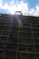 building under construction with crane