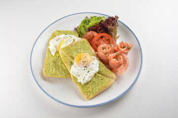 western luxury breakfast with avocado toast, boiled egg, smoked salmon fish, fried potato cake and salad halal breakfast menu 