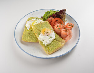 western luxury breakfast with avocado toast, boiled egg, smoked salmon fish, fried potato cake and salad halal breakfast menu 