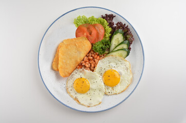 western big breakfast with butter toast, fried scramble egg, sausage, grill bacon, ham, omelette, bean and salad halal breakfast menu 