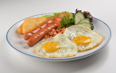western big breakfast with butter toast, fried scramble egg, sausage, grill bacon, ham, omelette, bean and salad halal breakfast menu 