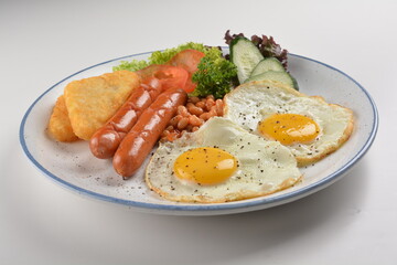 western big breakfast with butter toast, fried scramble egg, sausage, grill bacon, ham, omelette, bean and salad halal breakfast menu 