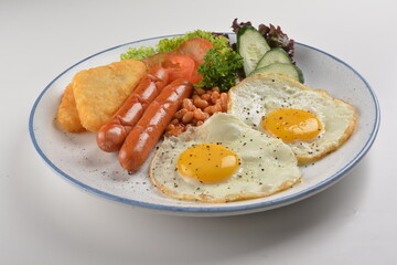 western big breakfast with butter toast, fried scramble egg, sausage, grill bacon, ham, omelette, bean and salad halal breakfast menu 