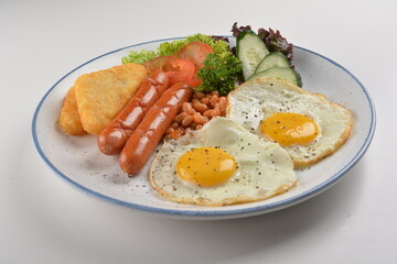 western big breakfast with butter toast, fried scramble egg, sausage, grill bacon, ham, omelette, bean and salad halal breakfast menu 