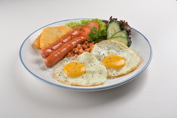 western big breakfast with butter toast, fried scramble egg, sausage, grill bacon, ham, omelette, bean and salad halal breakfast menu 