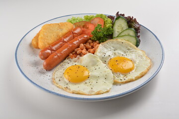 western big breakfast with butter toast, fried scramble egg, sausage, grill bacon, ham, omelette, bean and salad halal breakfast menu 