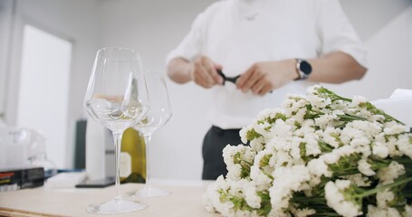 close up wine glass on the table with blurred Waiter man on background, celebrating with drinks at dinner party, Holidays Vacation Leisure Drinking Wine Food	
