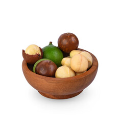 macadamia nuts in wooden bowl isolated on white background.