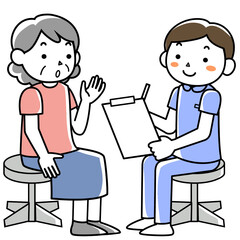 シニア女性に問診をする男性看護師