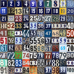 Vintage grunge square metal plates with street address numbers with numbers closely arranged from 1 to 100