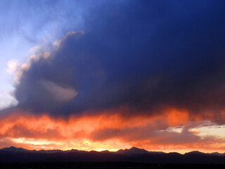 fiery sunset over the colorado rocky mountains as seen from Broomfield, colorado 