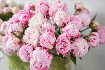 Lovely flowers in glass vase. Beautiful bouquet of pink peonies . Floral composition, scene, daylight. Wallpaper