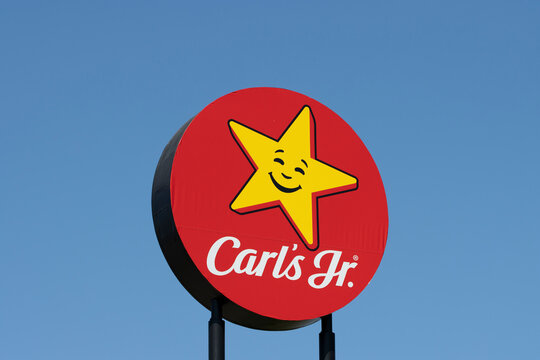 Portland, OR, USA - July 4, 2021: The logo of Carl's Jr. is seen outside one of its chain restaurants along an interstate highway in Portland, Oregon.