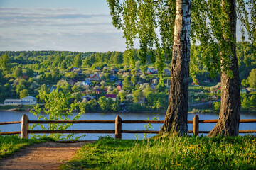 Fototapeta premium Old fence near the Volga river at sunset, Ivanovo region of Russia