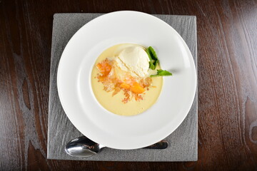 chilled mango fruit sago pomelo sweet soup with vanilla ice cream in dark background dessert halal menu