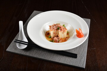 steamed fresh tofu bean curd with Japanese bonito and soy sauce asian in dark background halal menu