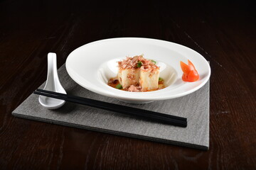 steamed fresh tofu bean curd with Japanese bonito and soy sauce asian in dark background halal menu