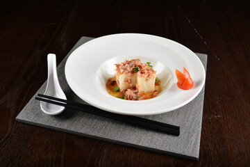 steamed fresh tofu bean curd with Japanese bonito and soy sauce asian in dark background halal menu