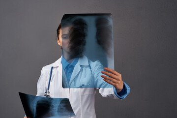 female doctor white coat medicine examination dark background