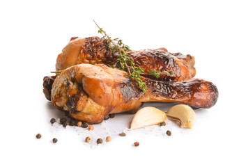 Roasted chicken legs on white background