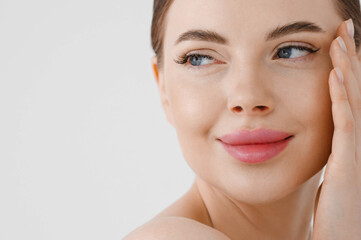 Obraz premium Beautiful woman face healthy skin natural make up lips close up blue eyes
