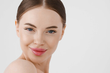 Obraz premium Beautiful woman face healthy skin natural make up lips close up blue eyes