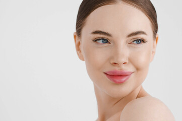Beautiful woman face healthy skin natural make up lips close up blue eyes