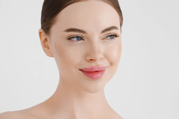 Fototapeta premium Beautiful woman face healthy skin natural make up lips close up blue eyes